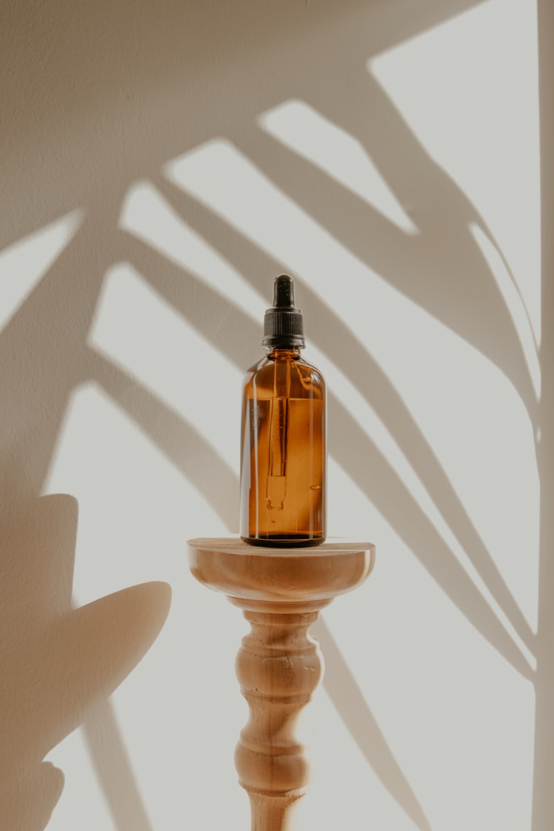 Essential oil bottle being held in a mindful moment, the soul of the Rootsar journey